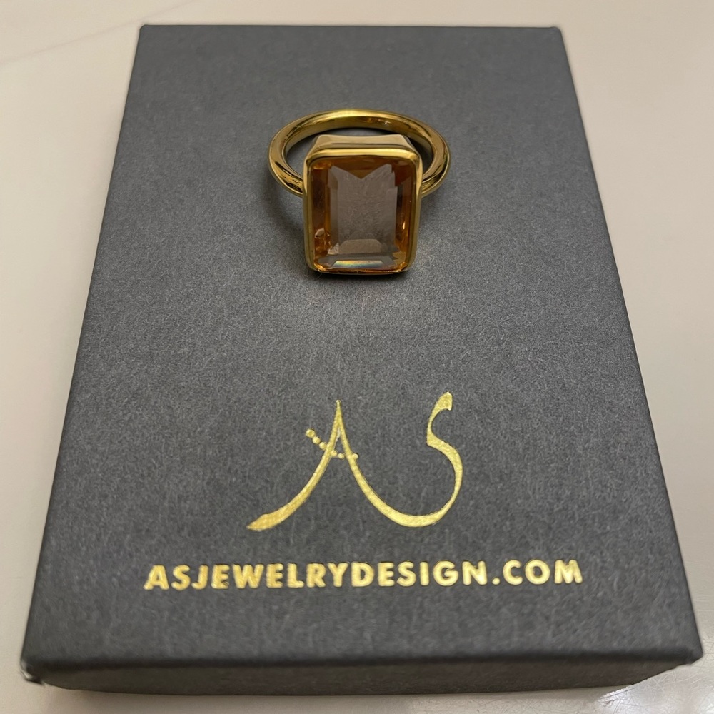 Emerald cut bezel set Morganite ring